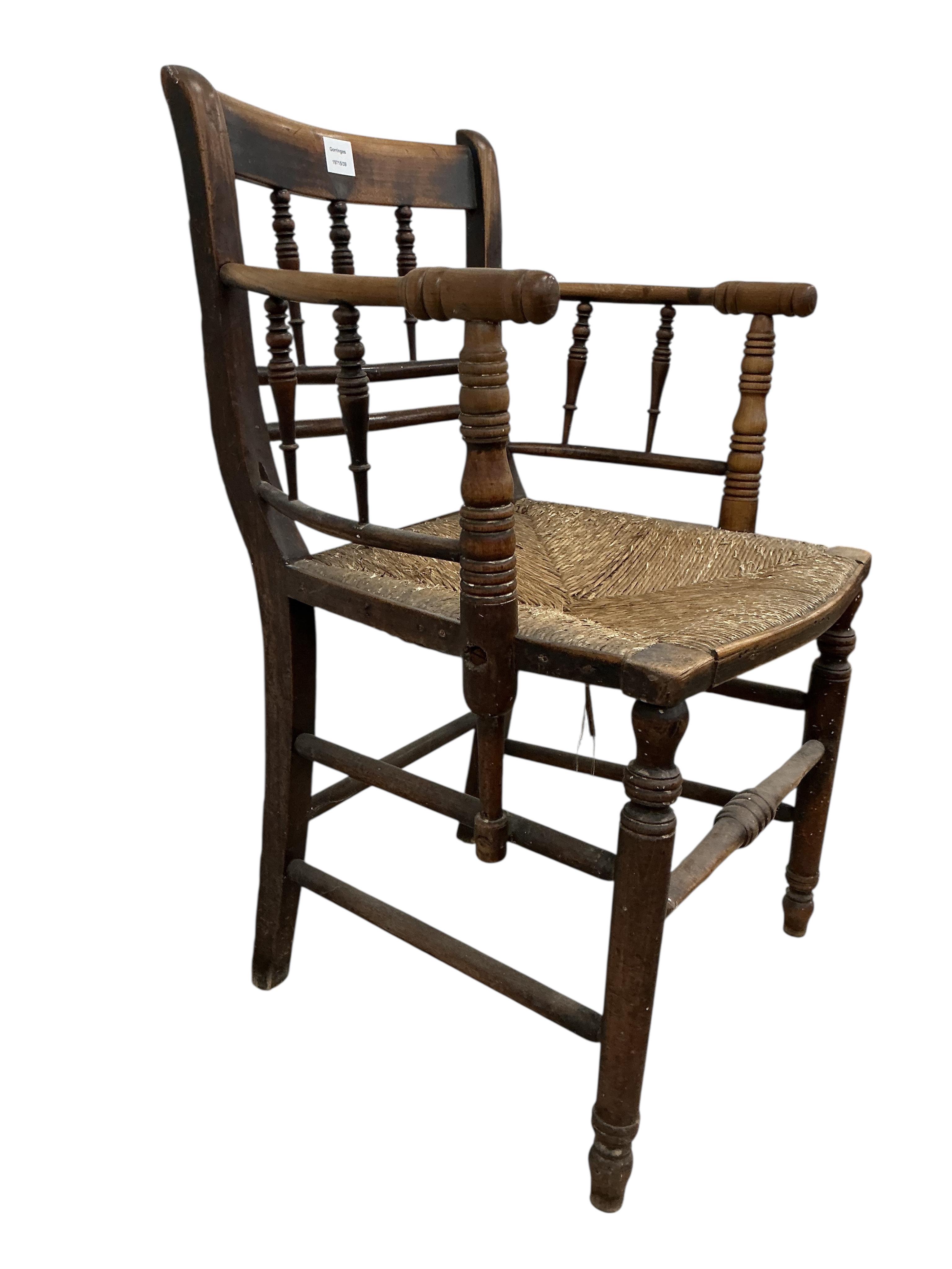 A Victorian Sussex style fruitwood rush seated elbow chair, width 53cm, depth 43cm, height 85cm